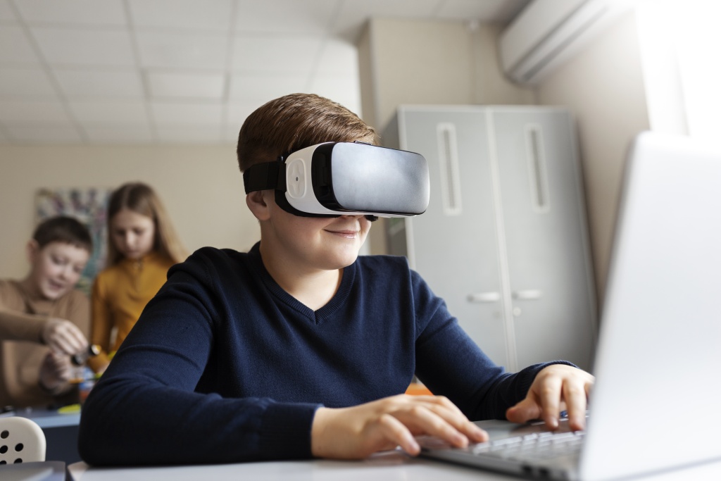 young-boy-using-laptop-vr-glasses.jpg young-boy-using-laptop-vr-glasses.jpg